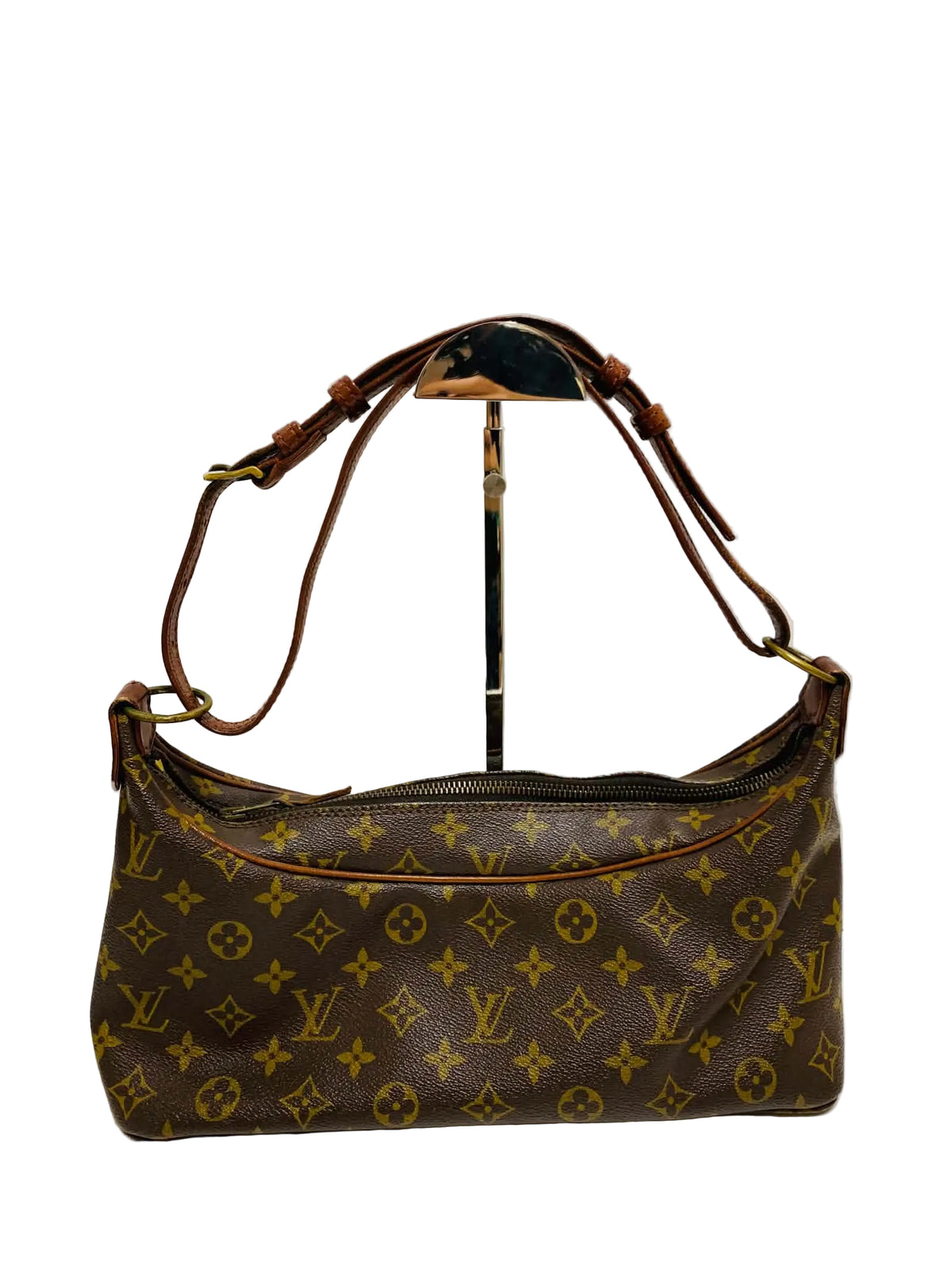A Louis Vuitton monogram shoulder bag in brown coated canvas with gold-tone hardware, displayed on a stand against a plain light background.