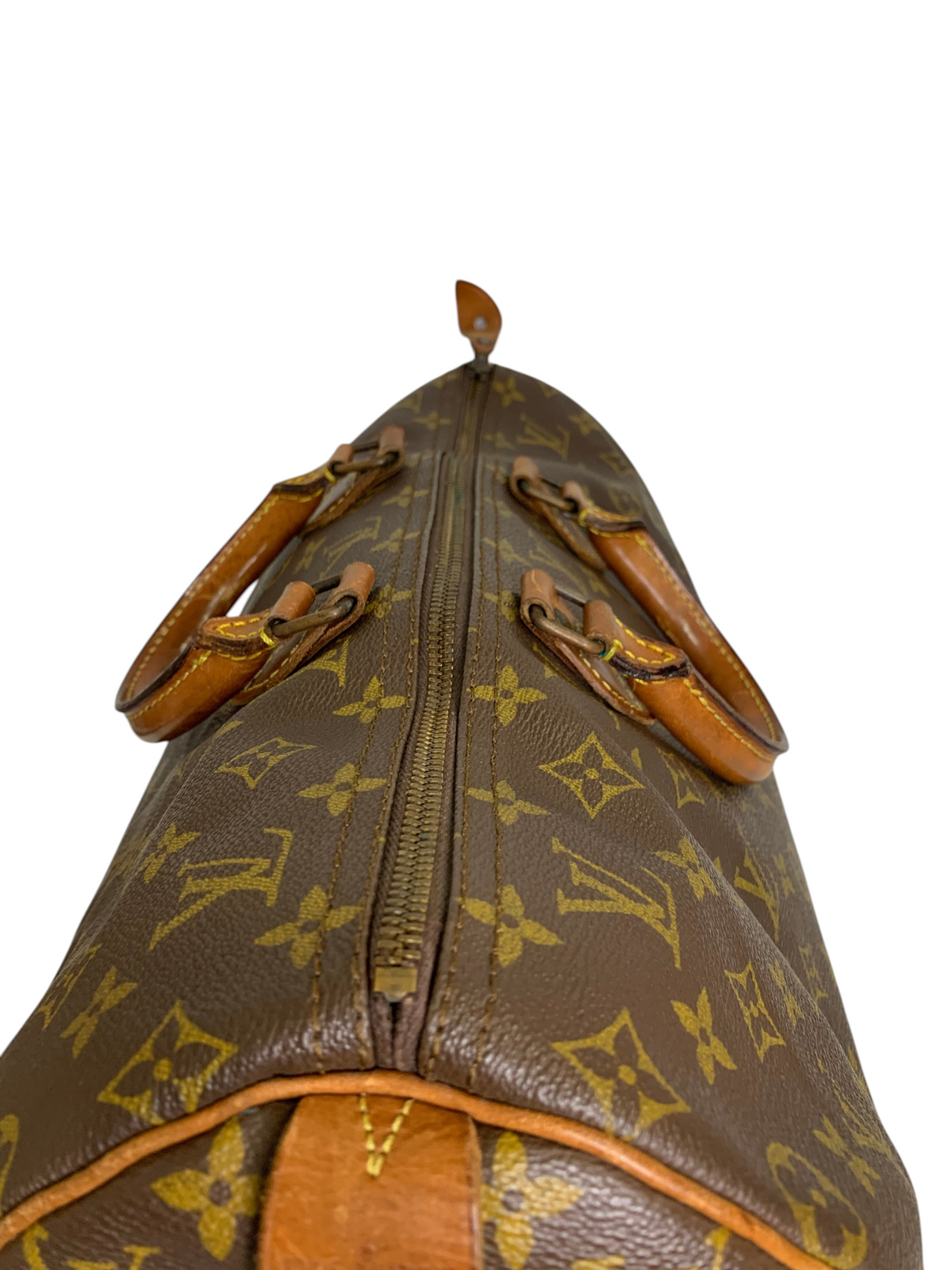Classic monogram coated canvas travel duffel bag with brown leather rolled handles and top-zip closure.