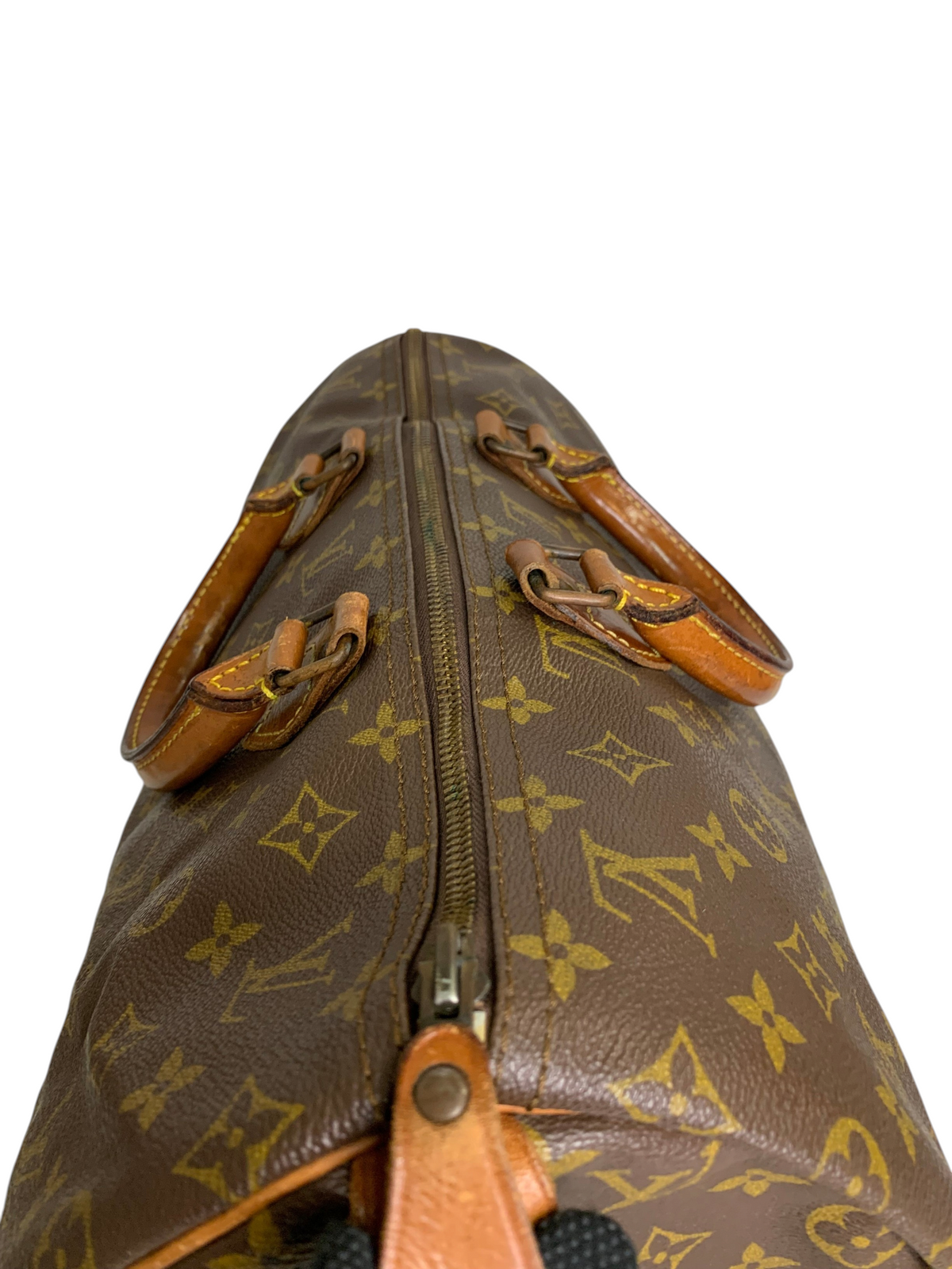 Classic brown monogram coated canvas travel duffel bag with rolled leather handles and top-zip closure.